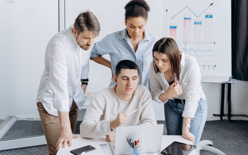 A team analysing competitor data and charts